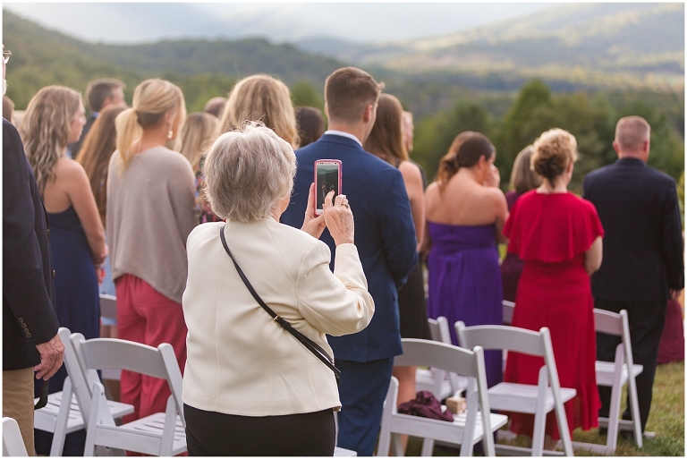 Sweet grandma stepped into the aisle to take a cell phone photo instead of just enjoying the moment